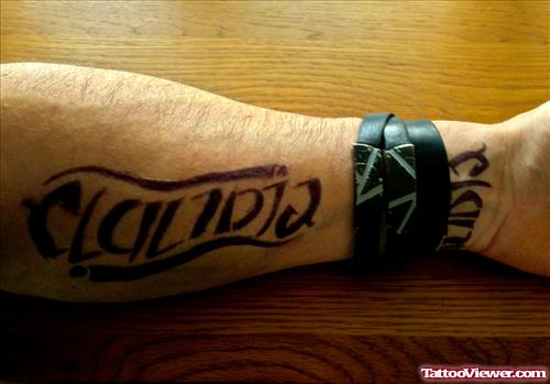 Left Arm Ambigram Tattoo On Forearm