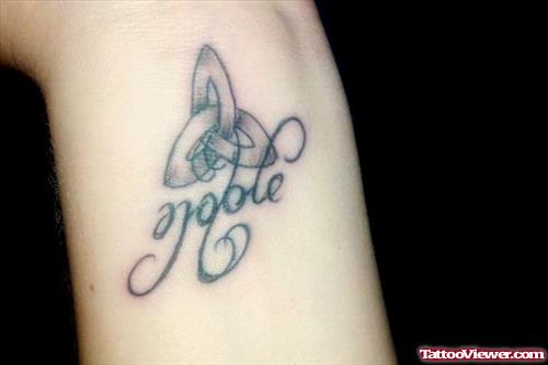 Knot And Noble Ambigram Tattoo On Wrist