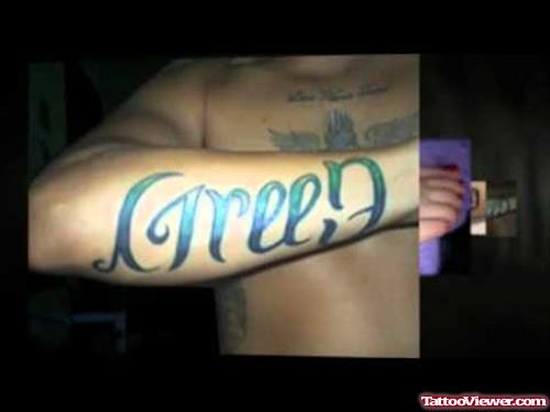 Green Ambigram Tattoo On Right Arm