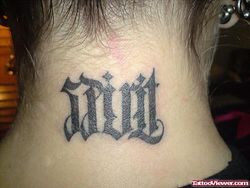 Black Ink Ambigram Tattoo On Nape