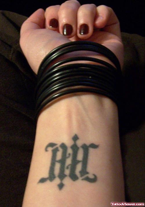 Ambigram Air Tattoo On Left Wrist