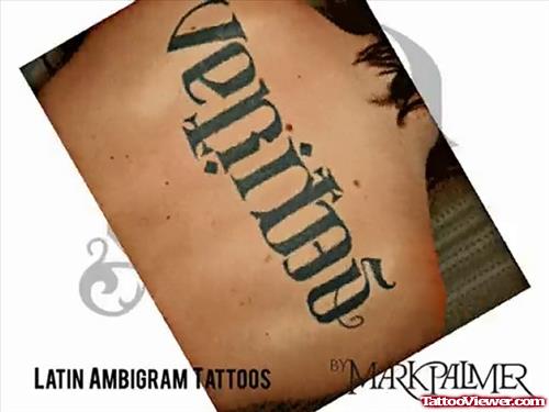 Veritas Ambigram Tattoo On Upperback
