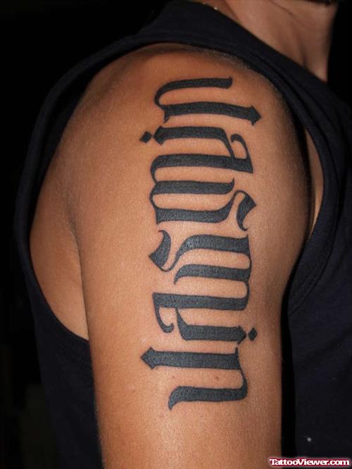 Black Ink Bold Ambigram Tattoo On Shoulder