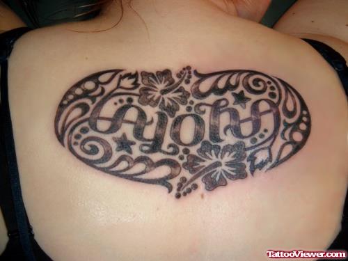 Grey Ink Flowers And Ambigram Tattoo On Upperback