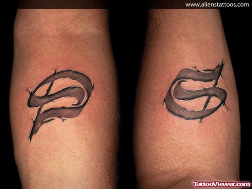 Grey Ink Ambigram D Tattoo On Arm