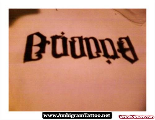 Attractive Black Ink Ambigram Tattoo