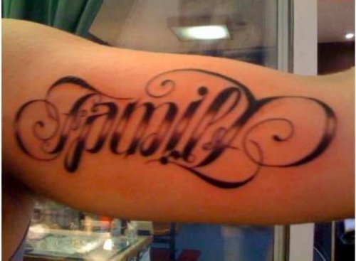 Black Ink Family Ambigram Tattoo On Muscles