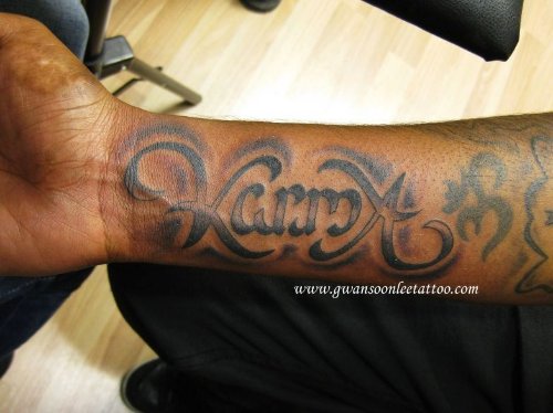 Karma Ambigram Tattoo On Right Arm