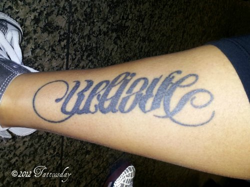 Believe Black Ink Ambigram Tattoo On Leg