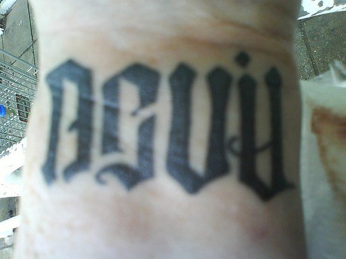 Devil angel Ambigram Tattoo On Wrist