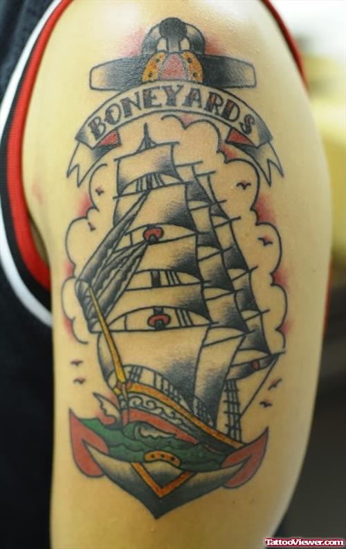 Ship And Colored Anchor Tattoo On Left Half Sleeve