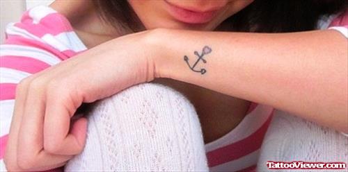 Girl With Anchor Tattoo On Left Wrist