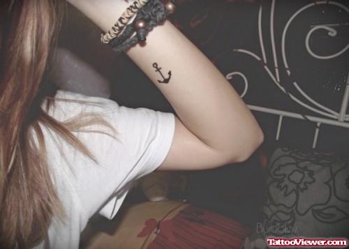Small Anchor Tattoo On Girl Left Arm