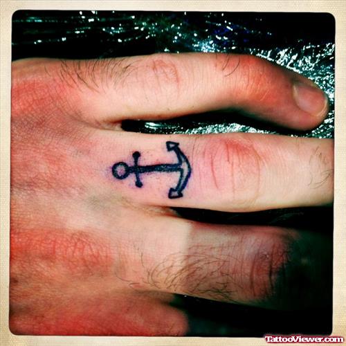 Man With Anchor Tattoo On Finger