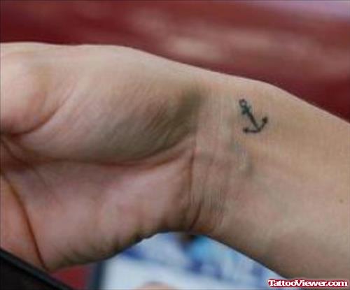 Small Anchor Tattoo On Right Wrist