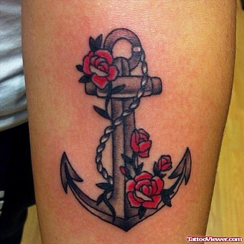Red Rose Flowers And Anchor Tattoo On Arm