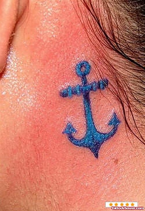Blue Ink Anchor Tattoo On Neck