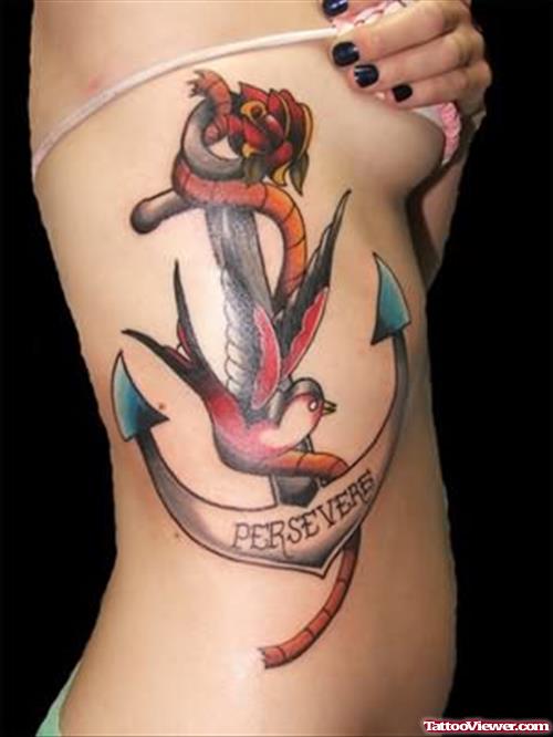 Colored Flying Bird And Anchor Tattoo On Side