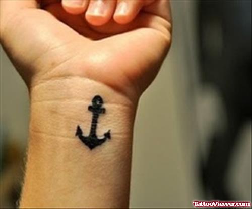 Anchor Black Ink Tattoo On Left Wrist