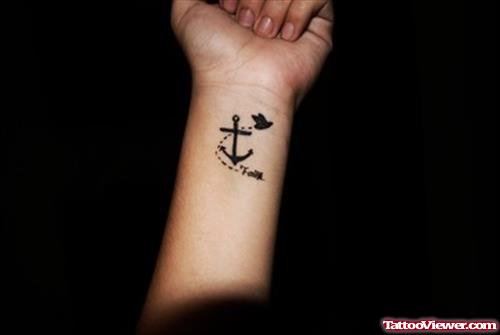 Flying Black Bird And Anchor Tattoo On Wrist
