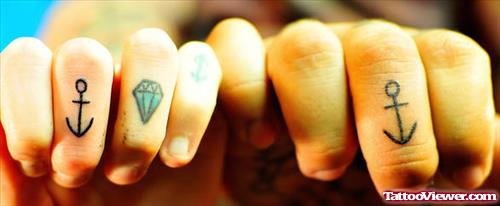 Diamond And Anchor Tattoo On Fingers