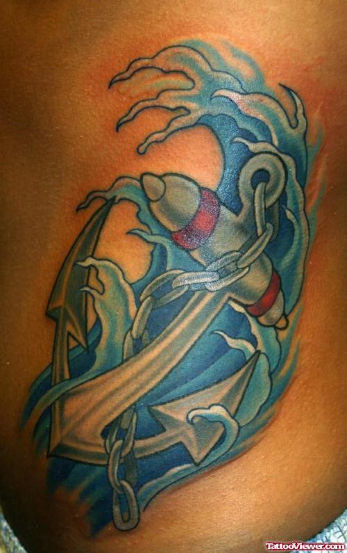 Blue Ink Water And Anchor Tattoo On Side