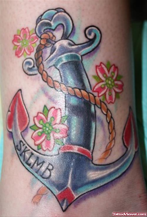 Awesome Cherry Blossom Flowers And Anchor Tattoo