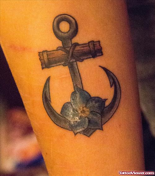 Awesome Anchor And Blue Flower Tattoo
