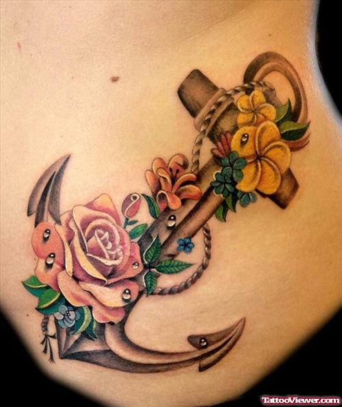 Colored Flowers And Anchor Tattoo