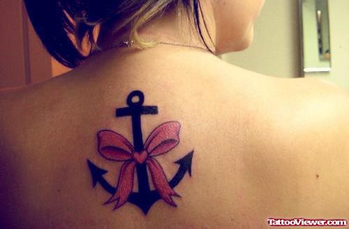 Black Anchor With Bow Tattoo On Upperback