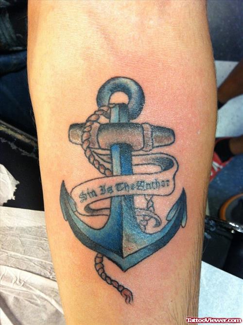 Blue Ink Anchor With Banner Tattoo On Arm