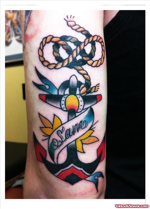 Banner And Anchor Tattoo On Biceps