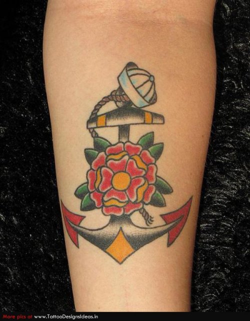 Red Flower And Anchor Tattoo On Arm