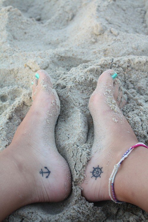 Compass And Anchor Tattoos On Both Heels