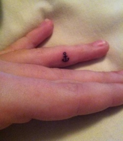 Tiny Anchor Tattoo On Finger