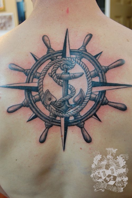 Ship Wheel And Anchor Tattoo On Upperback