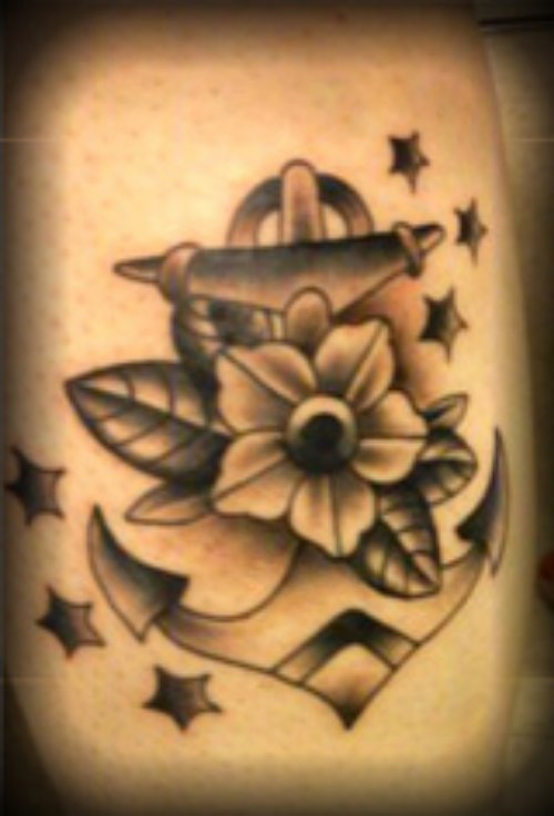 Grey Ink Anchor Tattoo With Flower And stars