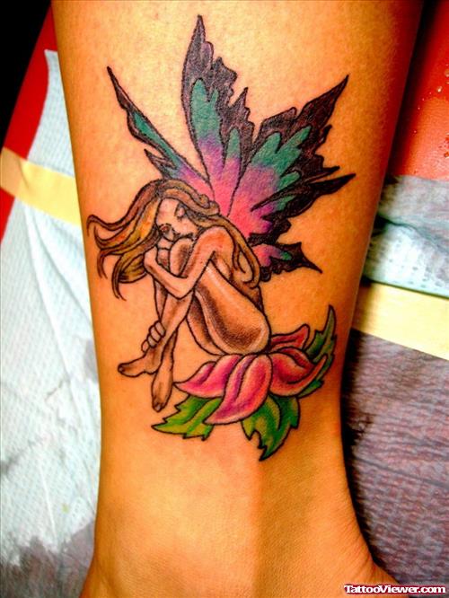 Color Ink Fairy Angel Sitting On Flower Tattoo