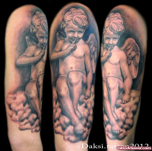 Grey Ink Baby Angel Tattoo On Biceps