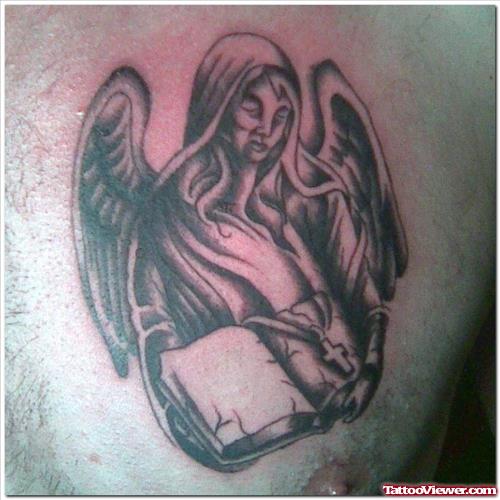 Angel With Book Grey ink Tattoo