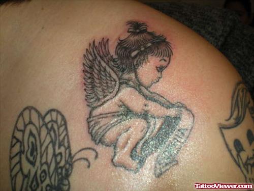Baby Angel With Banner Tattoo On Shoulder