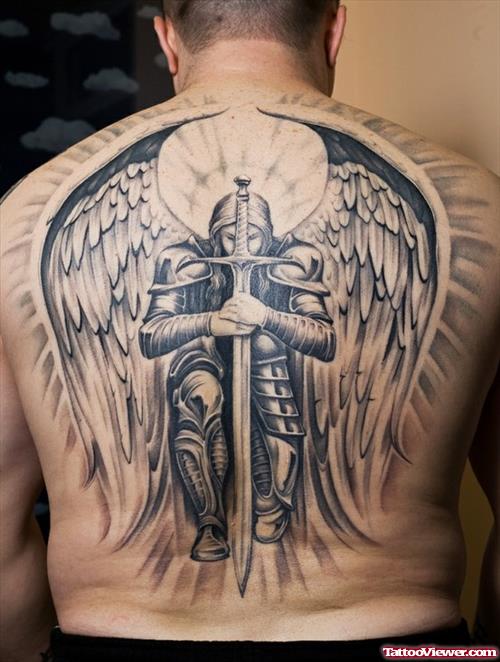Grey Ink Angel With Dagger Tattoo On Back