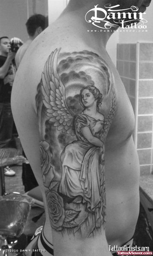 Grey Ink Angel Tattoo On Man Right Half Sleeve