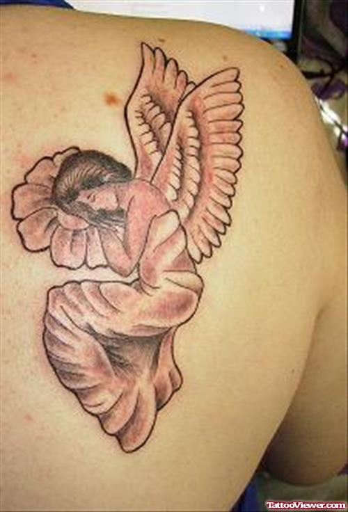 Sleeping Angel On Flower Tattoo On Right Back Shoulder