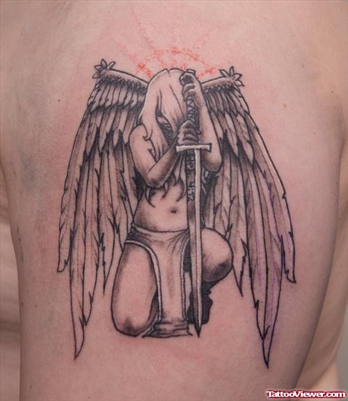 Sad Angel With Dagger Grey Ink Tattoo On Left SHoulder