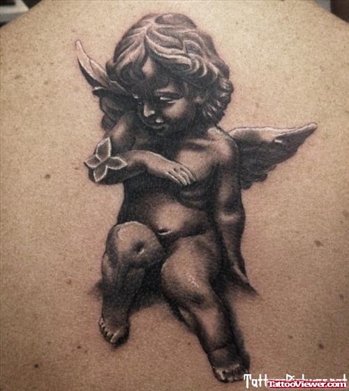 Grey Ink Baby Angel Tattoo On Back