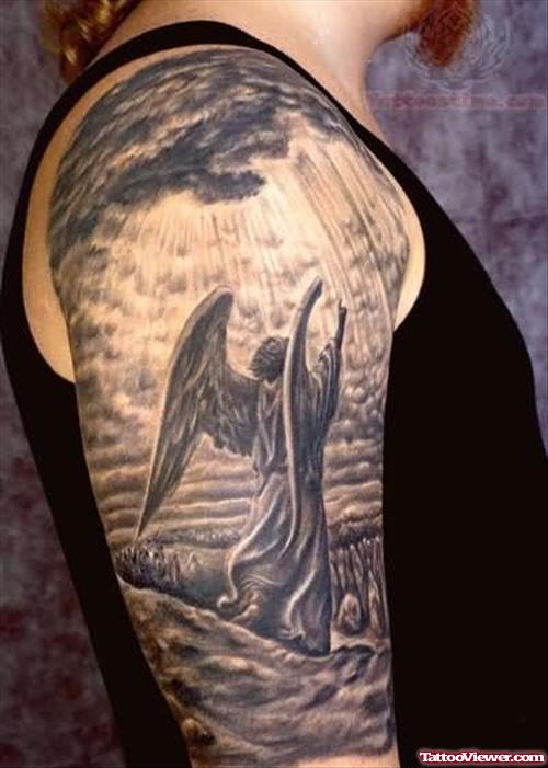 Grey Ink Angel Tattoo On Bicep