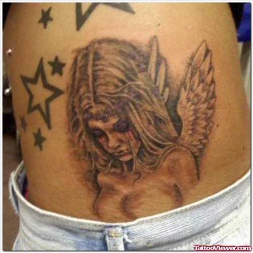 Star & Angel Tattoo On Waist