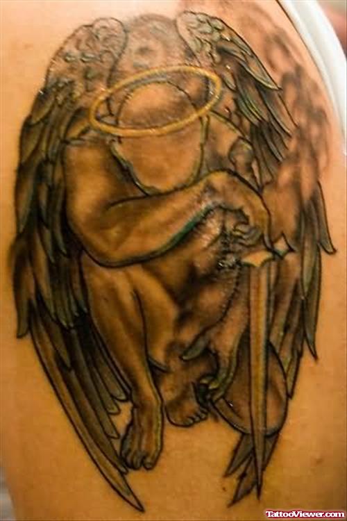 Dreaming Angel Tattoo On Biceps