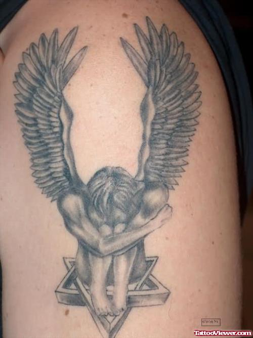 Sad Angel Tattoo On Biceps